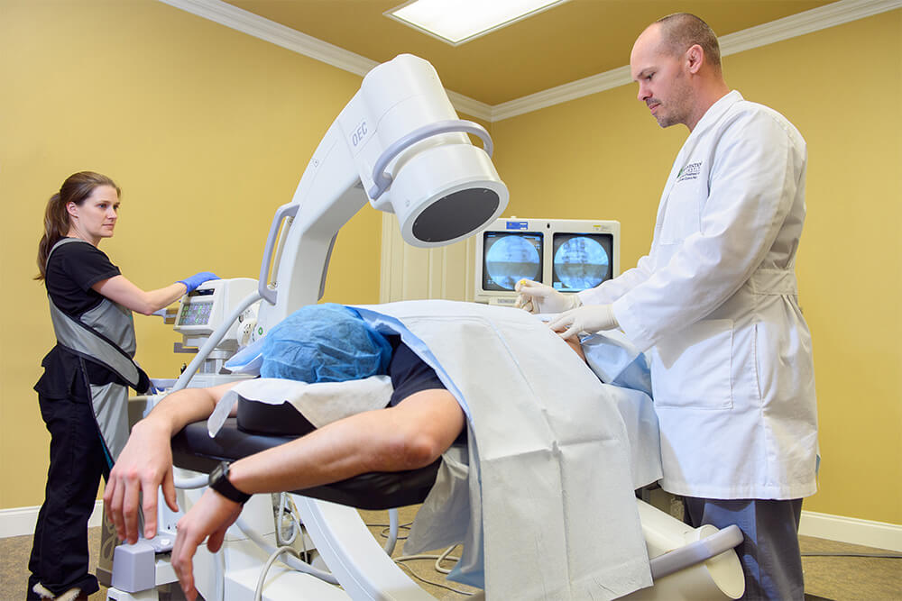 Dr. Barrett Johnston doing a low back pain treatment